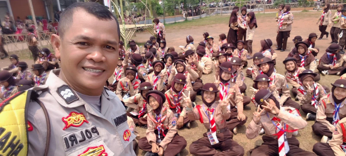 Bhabinkamtibmas Aiptu Budiansyah Hadiri Penutupan Lomba Tingkat II Pramuka Kecamatan Cikupa