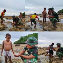 Personel Satgas TMMD Bermain dan Mencari Ikan Bersama Anak-anak Saat Air Laut Surut Personel Satgas TMMD Bermain dan Mencari Ikan Bersama Anak-anak Saat Air Laut Surut